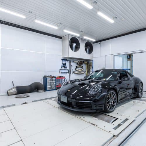 Porsche on a dyno getting a testing and custom tuning