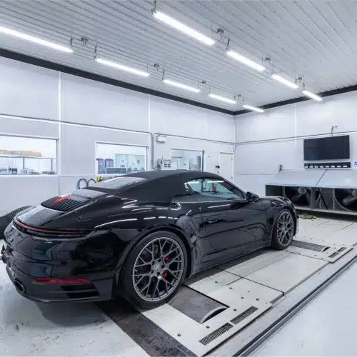 Porsche on a dyno getting a custom tuning