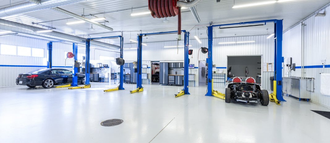 BMW and classic car in the service area at RSP Motorsports